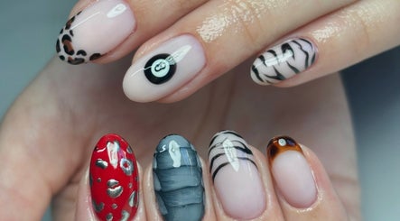 Creative nail designs at The Nail Garden, Lansing, Michigan, US, showcasing diverse art styles.