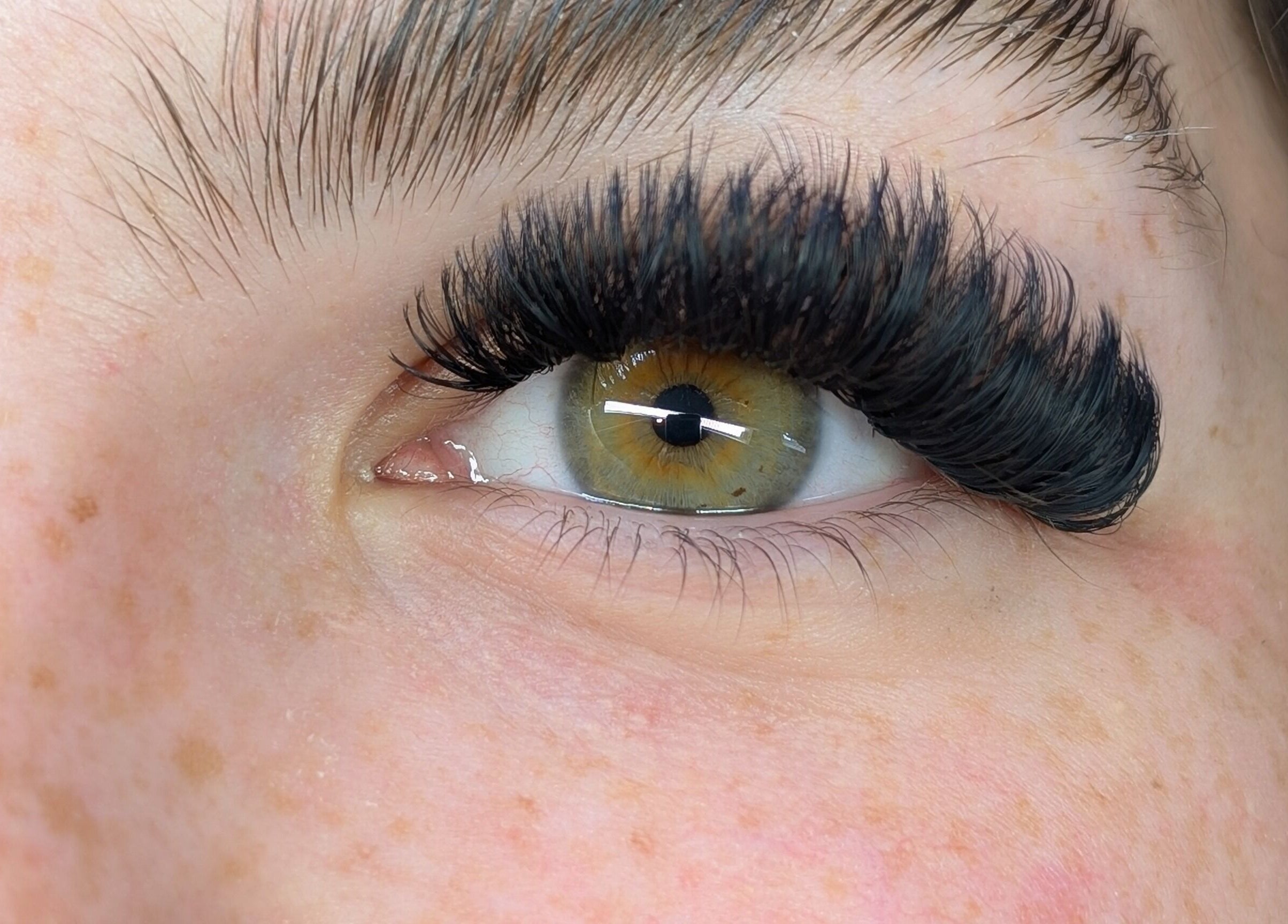 Close-up of eyelash extension at Claire'ity Care in Blackfalds, Alberta, CA showcasing intricate lash design.