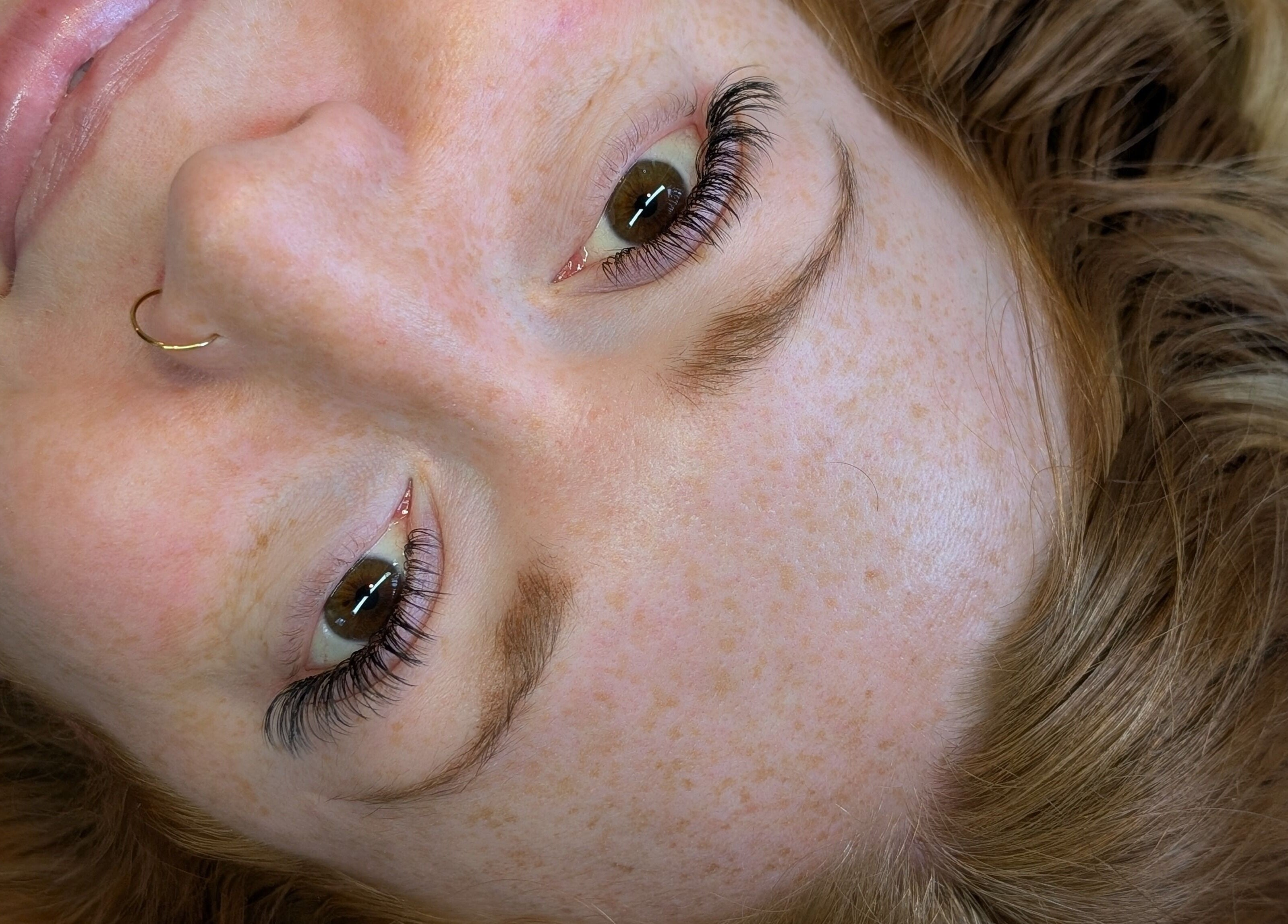 Close-up of a woman with enhanced eyelashes at Claire'ity Care, Blackfalds, Alberta, CA.