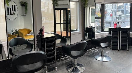 Modern salon interior at Anthea Hairstylist, Stellenbosch, Western Cape, ZA with stylish black seating.