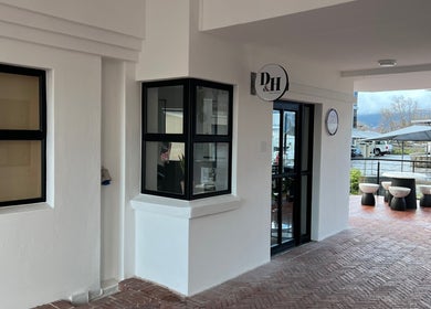Anthea Hairstylist entrance at Stellenbosch, Western Cape, ZA with elegant outdoor seating.