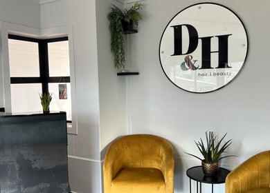 Stylish reception at Anthea Hairstylist, Stellenbosch, Western Cape, ZA with modern decor and comfy seating.