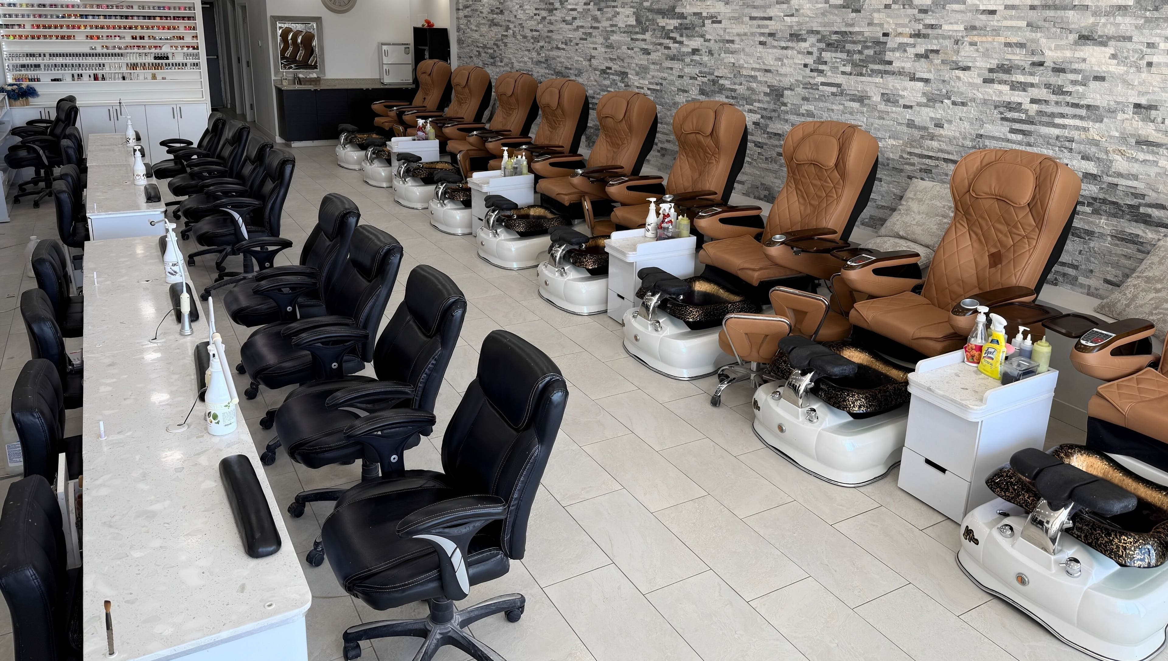 Pedi N Nails - Hespeler Cambridge interior showing plush seating and nail stations in Cambridge, Ontario, CA.