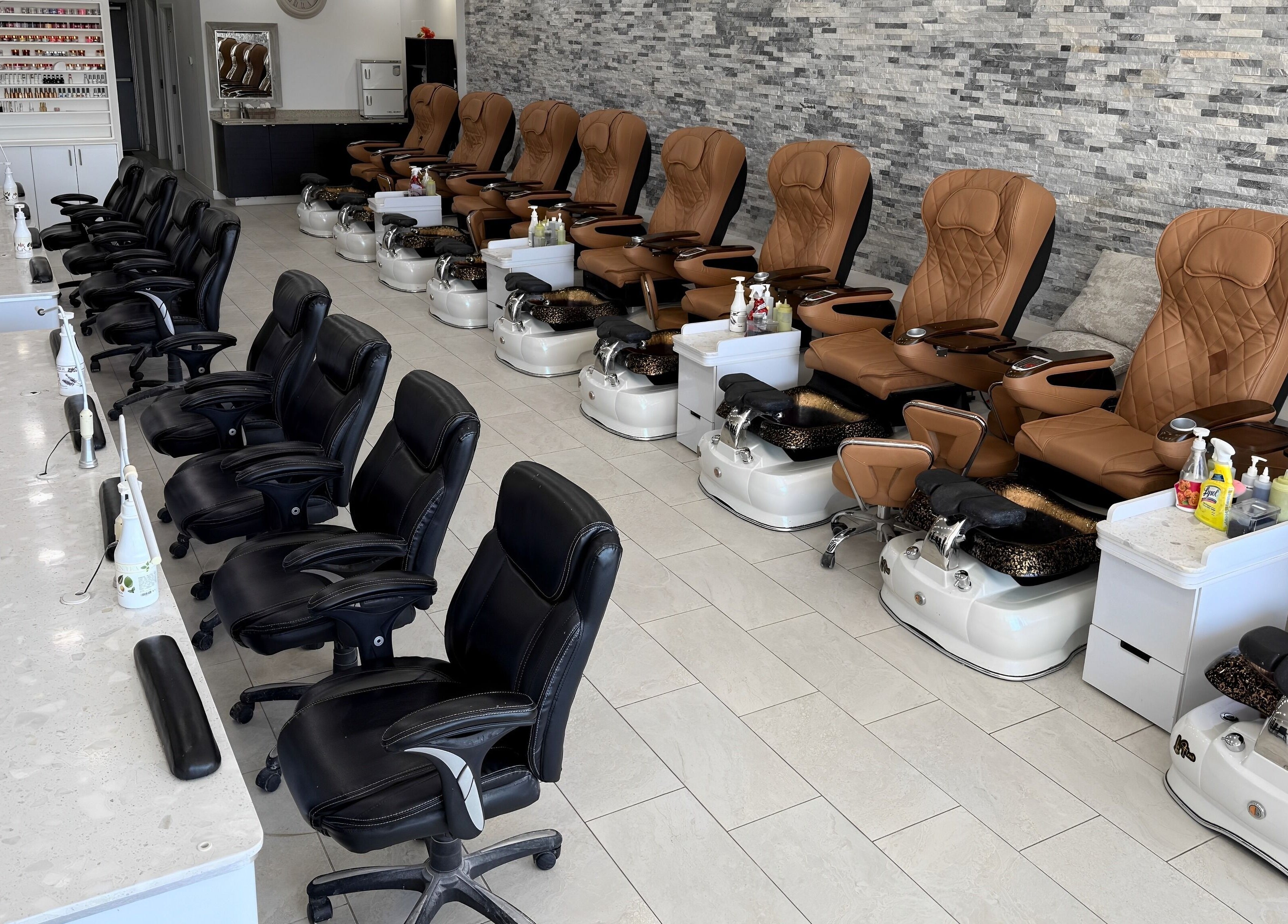 Pedi N Nails - Hespeler Cambridge interior showing plush seating and nail stations in Cambridge, Ontario, CA.