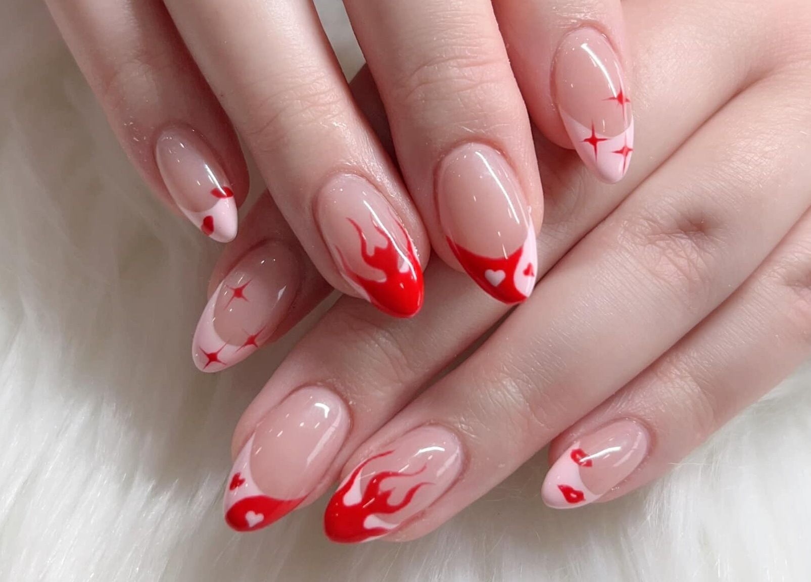Fiery red nail art with hearts at Pedi N Nails - Hespeler Cambridge in Cambridge, Ontario, CA.