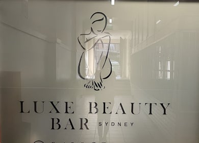 Entrance of Luxe Beauty Bar Sydney with stylish logo, located in Earlwood, New South Wales, AU.