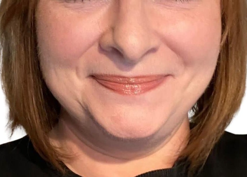 A smiling person showcasing skincare results at Skin Essentials & Neuro Reflexology Wexford, County Wexford, IE.