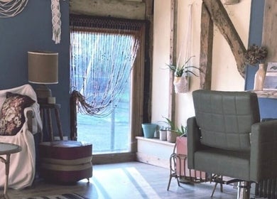 Relaxing corner at HIVEhair by Tabbie in The Barn, Wrentham, England, GB with stylish decor and seating.