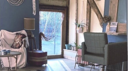Relaxing corner at HIVEhair by Tabbie in The Barn, Wrentham, England, GB with stylish decor and seating.