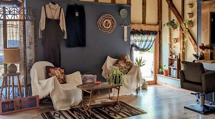 Cozy interior of HIVEhair by Tabbie in The Barn, Wrentham, England, GB with chairs and decor.