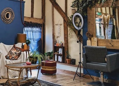 Rustic and cozy interior of HIVEhair by Tabbie in The Barn, Wrentham, England, GB, featuring wooden beams.