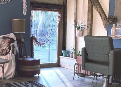 Cozy interior of HIVEhair by Tabbie in The Barn, Wrentham, England, GB showcasing rustic charm and comfort.