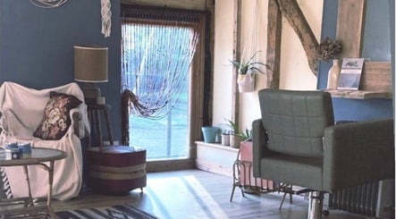 Cozy interior of HIVEhair by Tabbie in The Barn, Wrentham, England, GB showcasing rustic charm and comfort.
