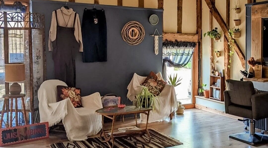 Cozy corner in HIVEhair by Tabbie in The Barn, Wrentham, England, GB, featuring rustic decor and soft lighting.