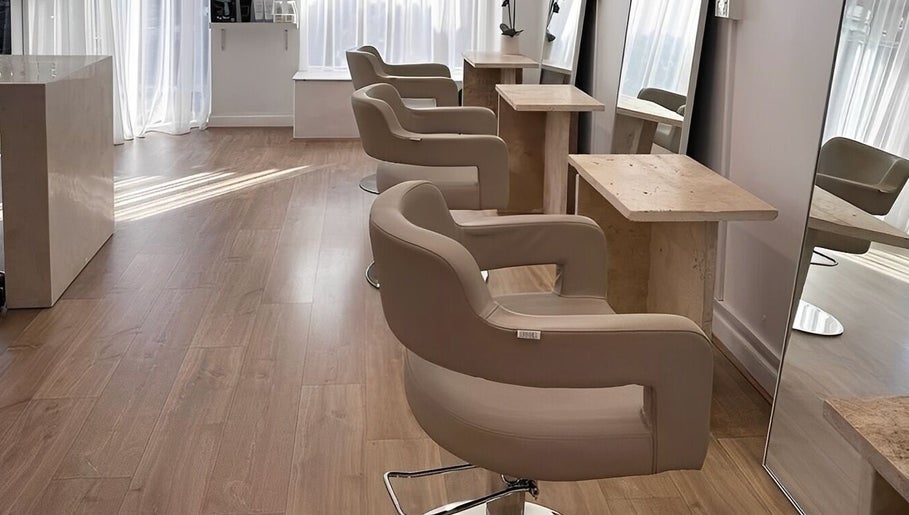 Elegant styling chairs and mirrors at Mica Hair, Melbourne, Victoria, AU, showcasing a modern salon interior.