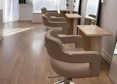 Elegant styling chairs and mirrors at Mica Hair, Melbourne, Victoria, AU, showcasing a modern salon interior.