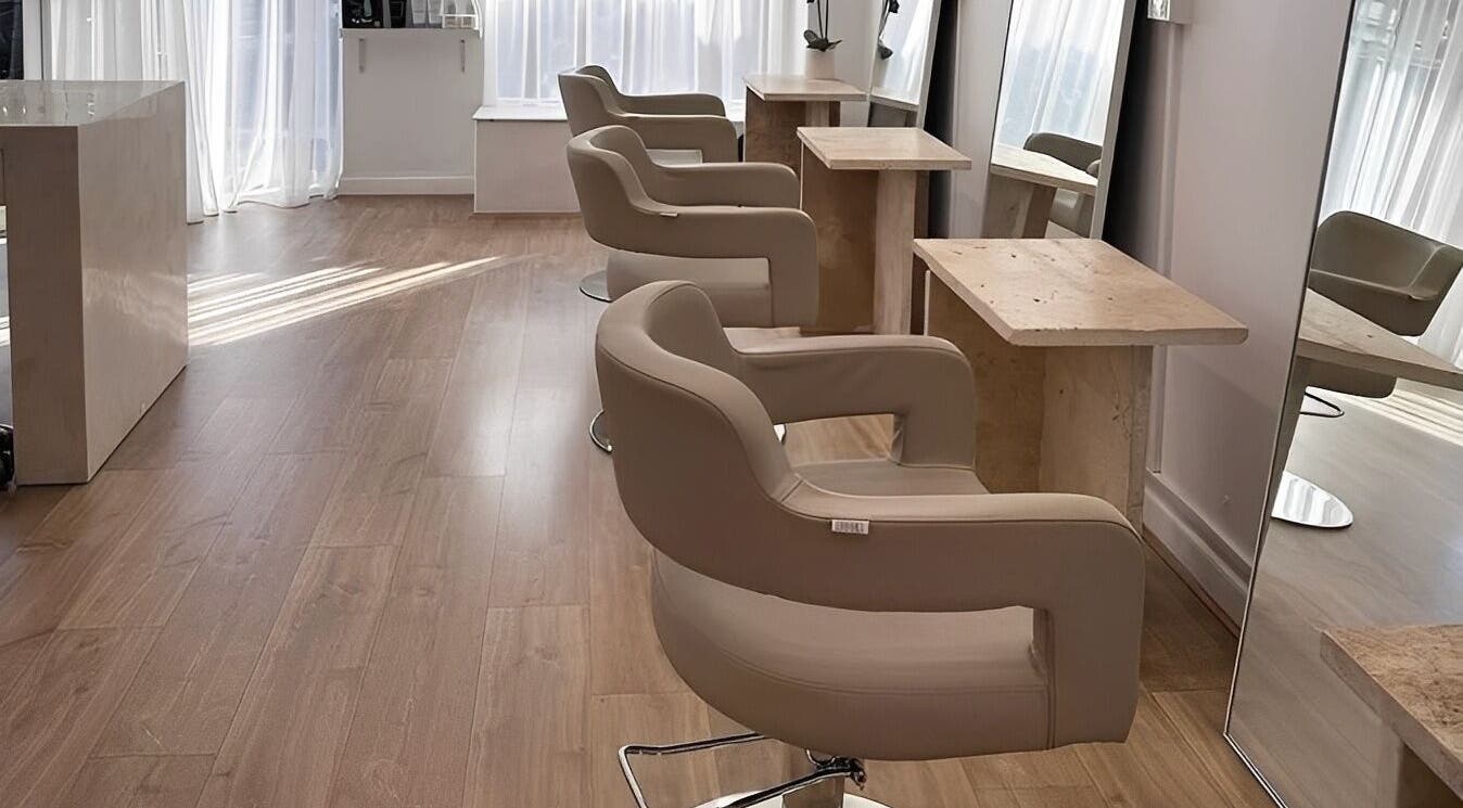 Elegant styling chairs and mirrors at Mica Hair, Melbourne, Victoria, AU, showcasing a modern salon interior.