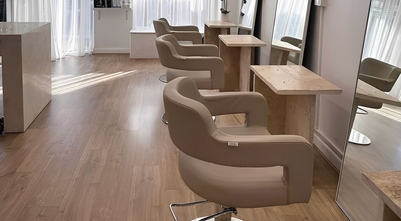Elegant styling chairs and mirrors at Mica Hair, Melbourne, Victoria, AU, showcasing a modern salon interior.