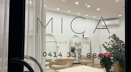 Chic interior view of Mica Hair salon in Melbourne, Victoria, AU with stylish decor and comfortable seating.
