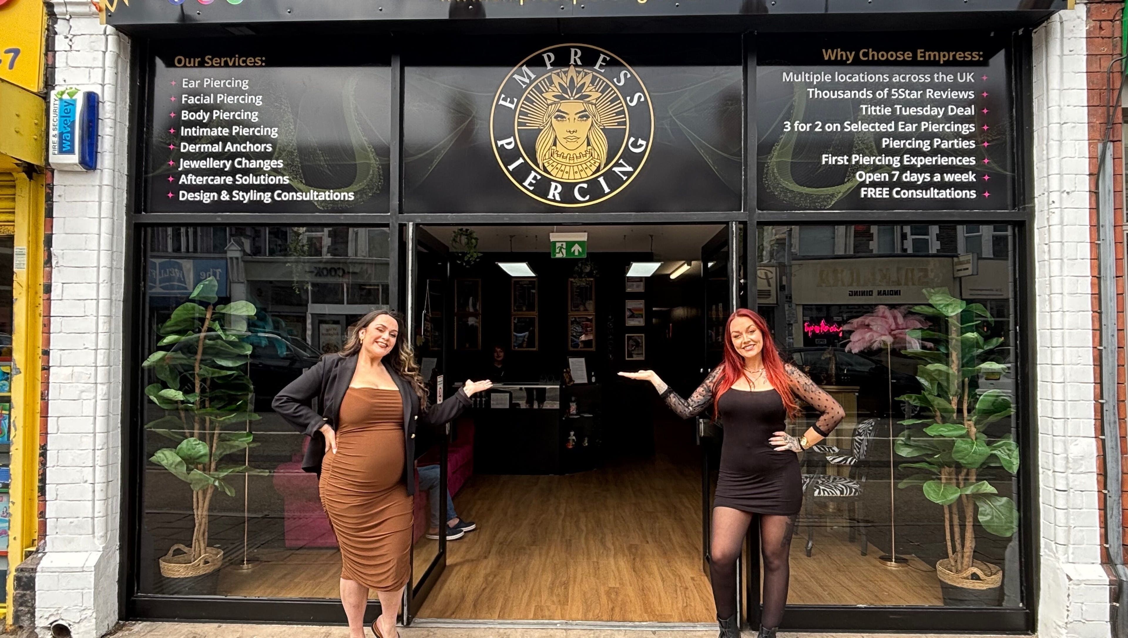 Welcoming entrance of Empress Piercing Cardiff with staff at Cardiff, Wales, GB.