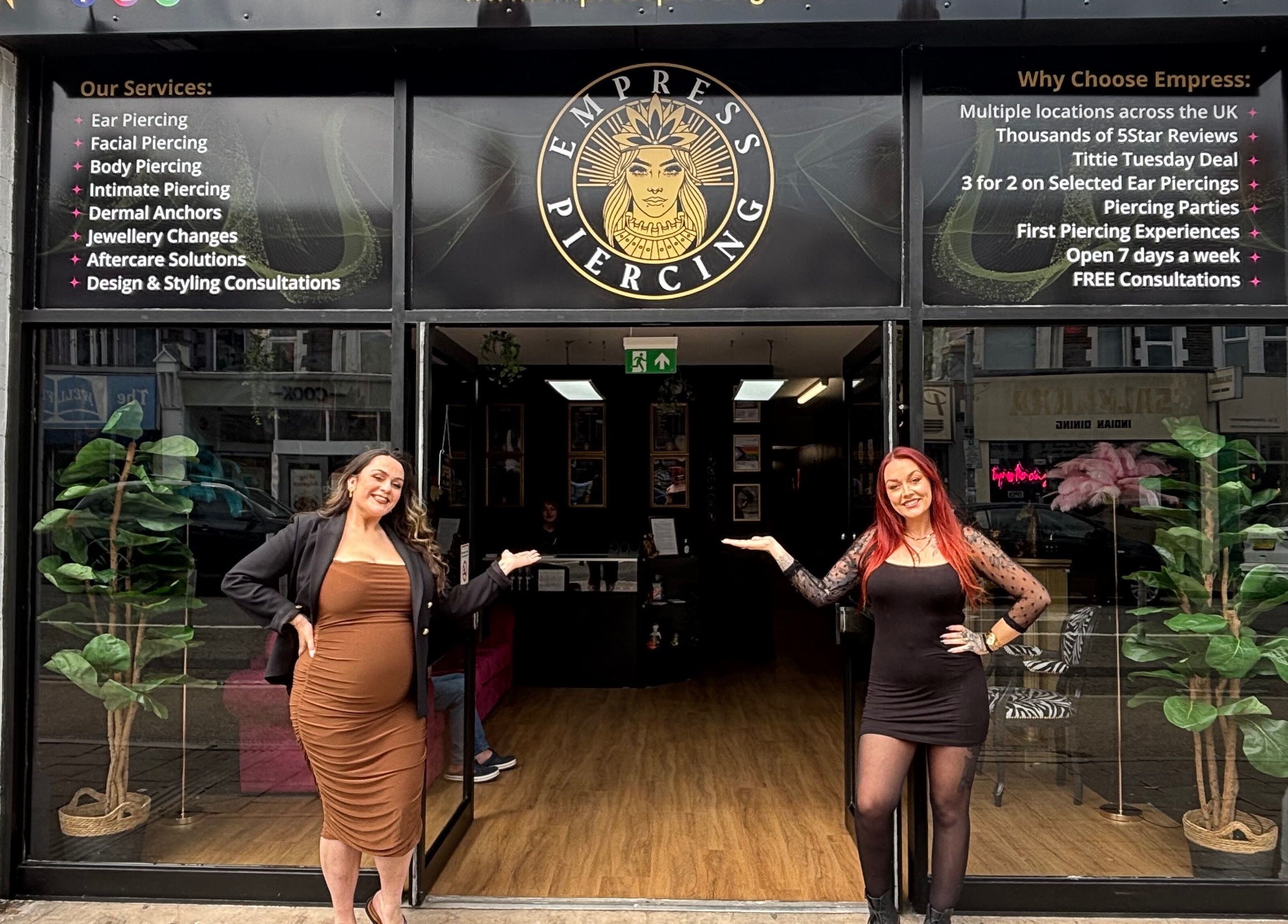 Welcoming entrance of Empress Piercing Cardiff with staff at Cardiff, Wales, GB.
