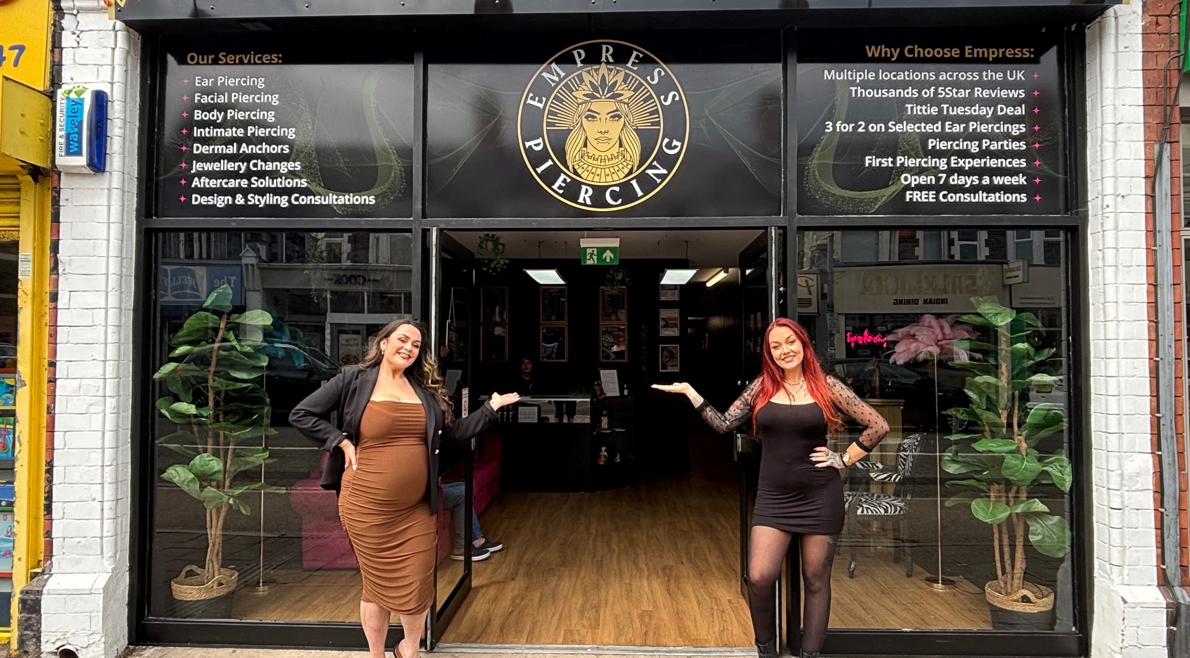 Welcoming entrance of Empress Piercing Cardiff with staff at Cardiff, Wales, GB.