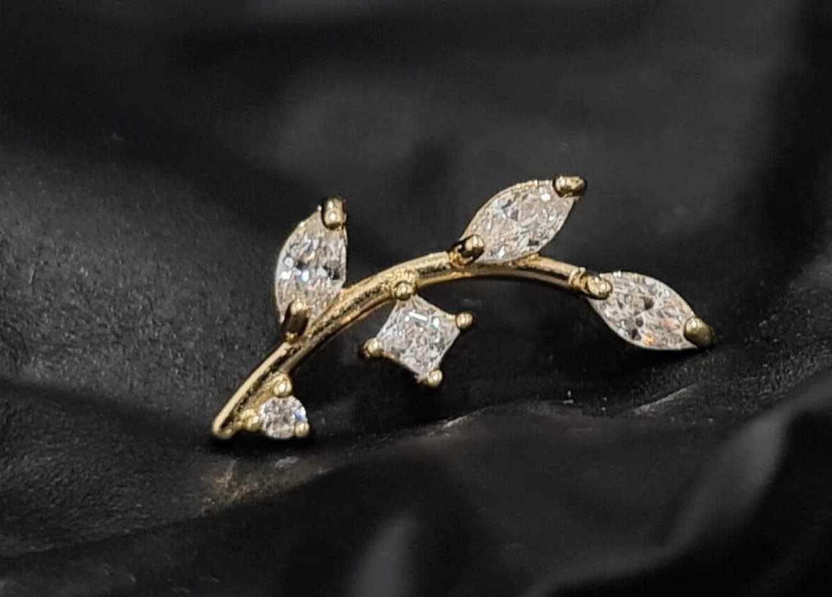 Gold branch earring with crystals from Empress Piercing Cardiff, located in Cardiff, Wales, GB.