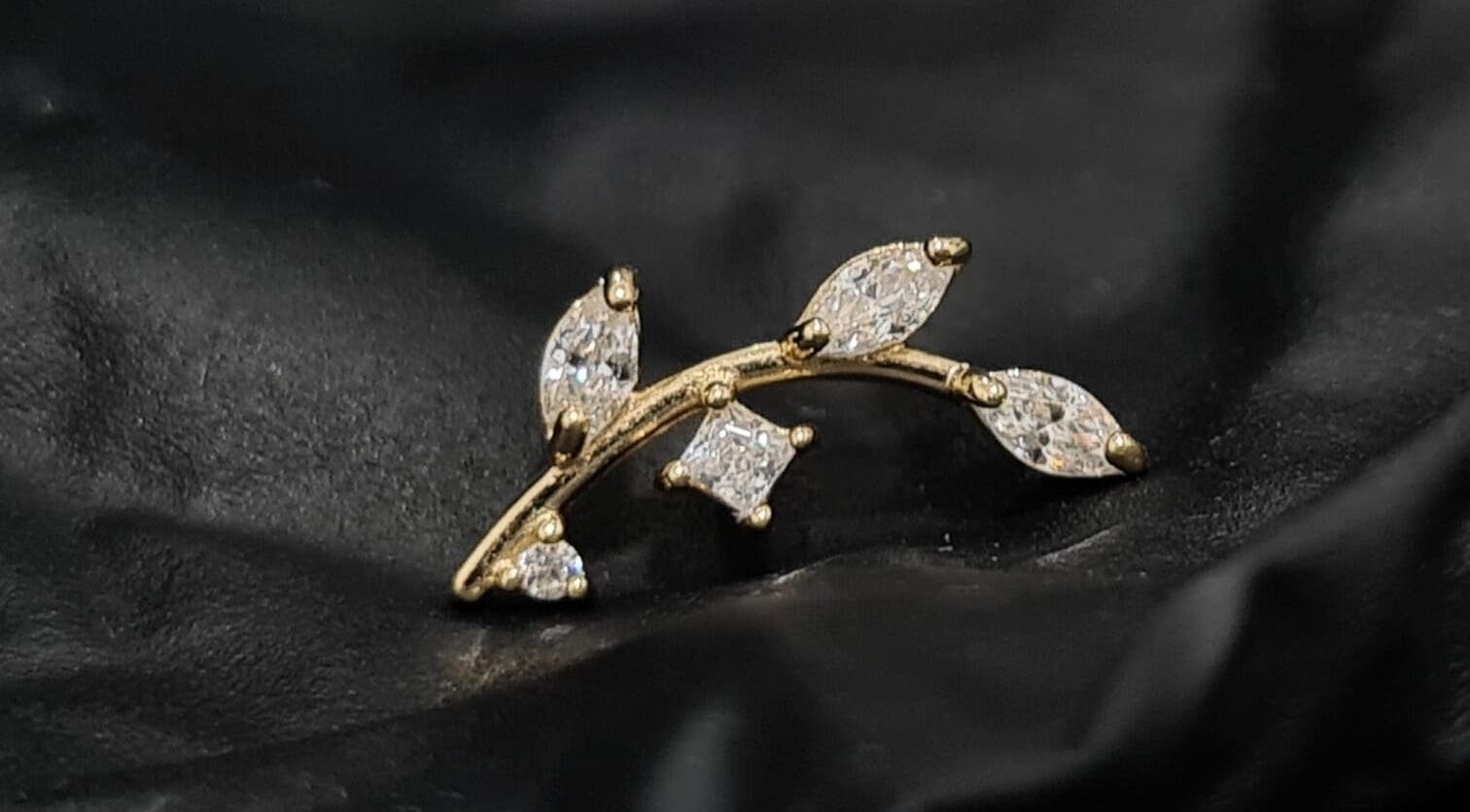 Gold branch earring with crystals from Empress Piercing Cardiff, located in Cardiff, Wales, GB.