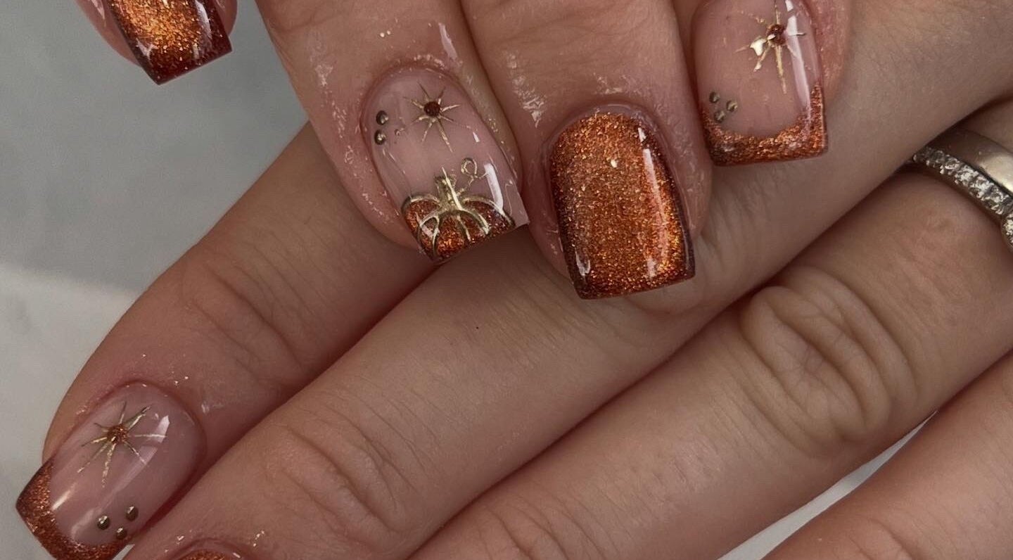 Glistening autumn-themed nails with intricate designs at Mood Nails & Beauty, Swansea, Wales, GB.