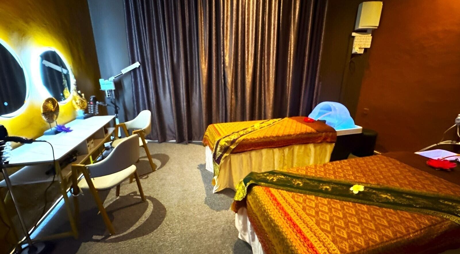 Relaxing spa room at Siam Kenyalang Wellness Centre & Family Spa, Kuching, Sarawak, MY with massage beds and decor.