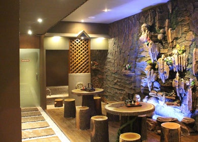 Siam Wellness Centre and Family Spa in Cheras, Selangor, MY featuring natural rustic decor and calming lighting.