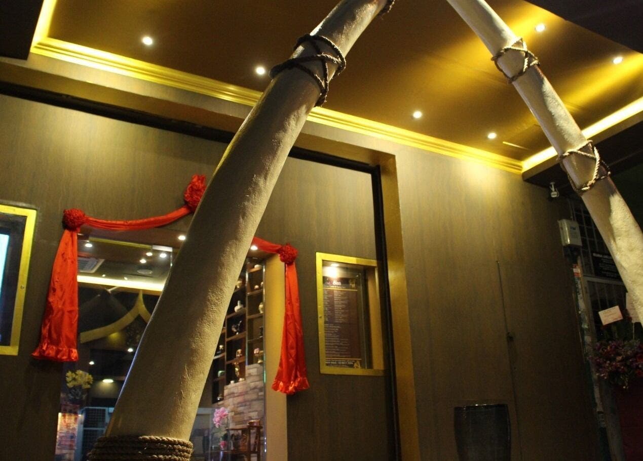 Entrance of Siam Wellness Centre and Family Spa in Cheras, Selangor, MY with decorative red ribbons.