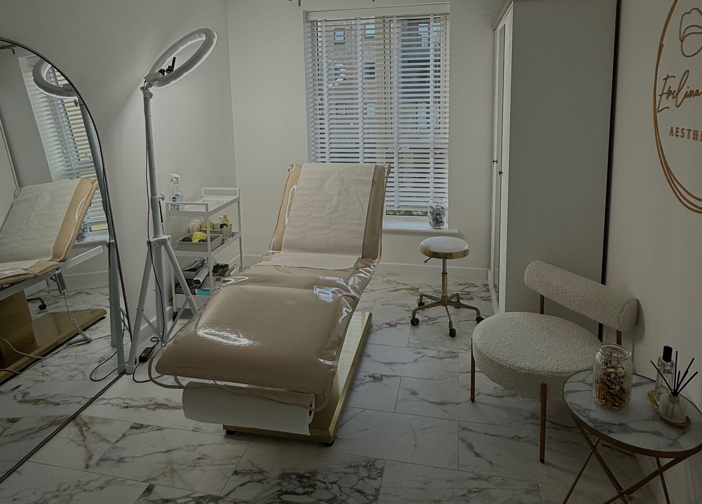 Modern treatment room at Ewelina Jakubus Aesthetics, Harlow, England, GB. Features sleek decor and professional lighting.