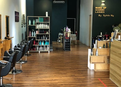Interior view of Hair Vogue Studio in Gelang Patah, Johor, MY, featuring modern salon chairs and shelves.