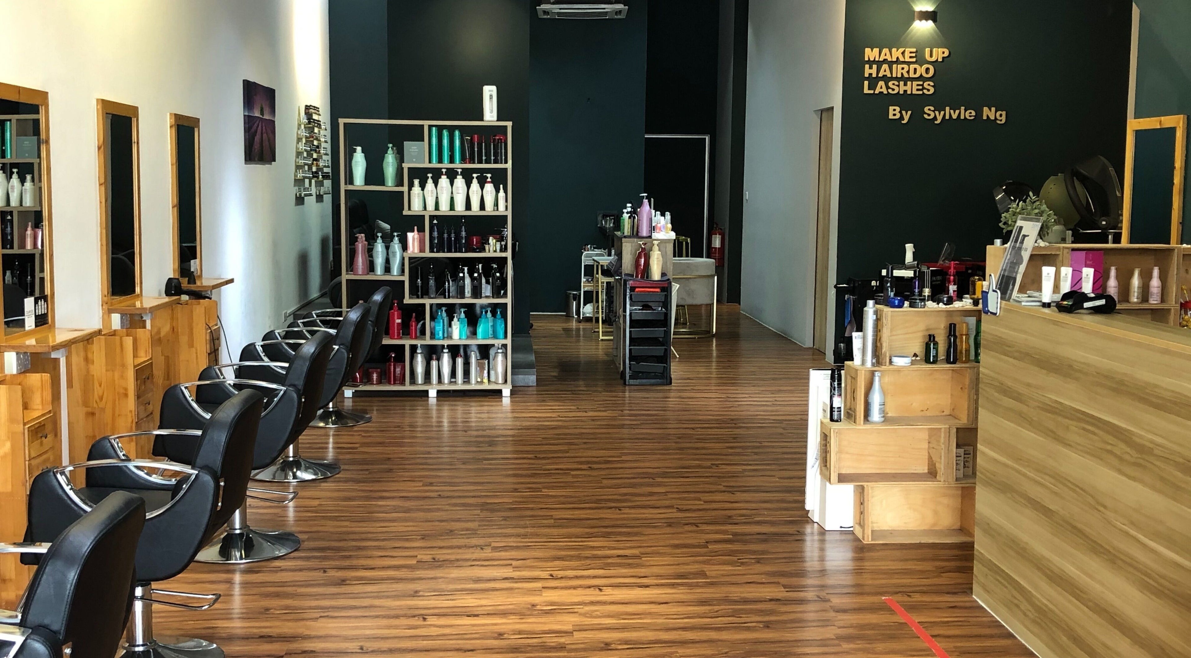 Interior of Hair Vogue Studio showcasing salon chairs and product shelves in Gelang Patah, Johor, MY.
