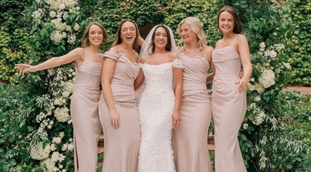 Bridal party at FMN Studio, Mungret Village, County Limerick, IE, surrounded by floral elegance.