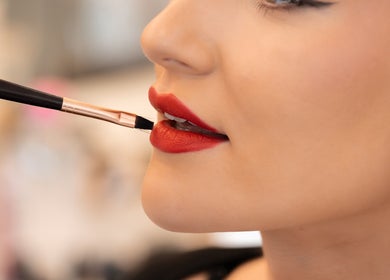 Close-up of red lipstick application at FMN Studio, Mungret Village, County Limerick, IE.