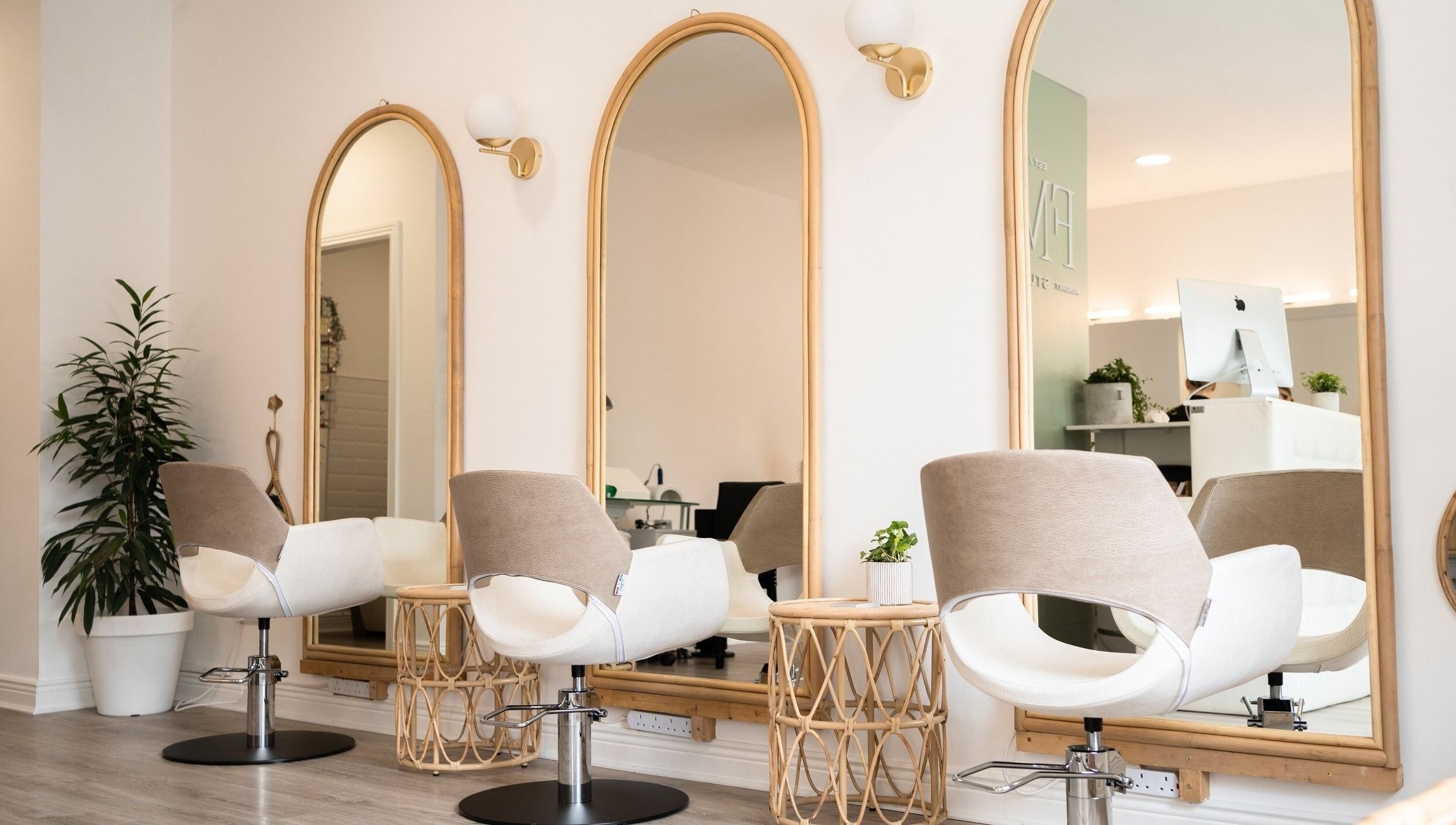 Chic salon interior at FMN Studio, Mungret Village, County Limerick, IE with modern chairs and elegant mirrors.