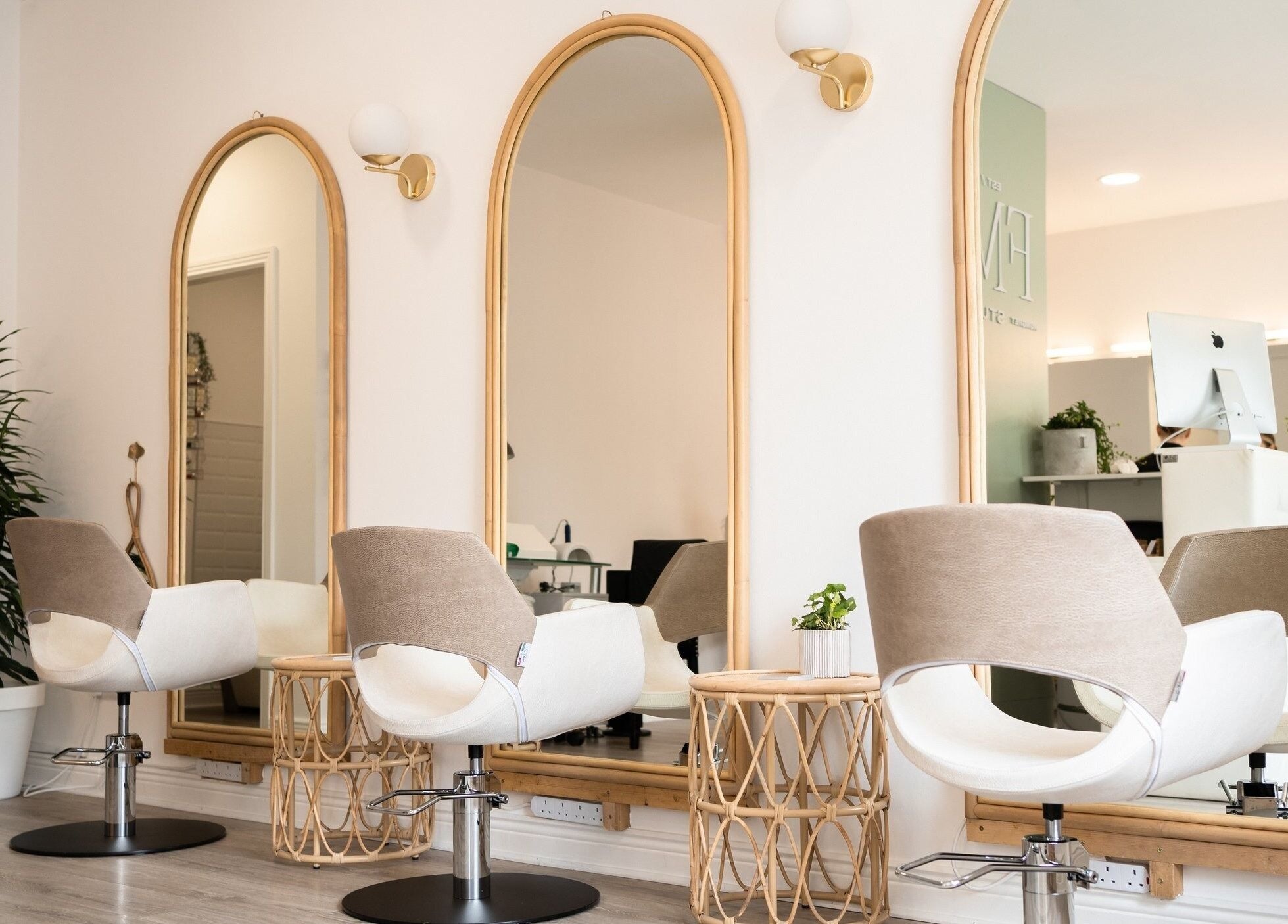 Chic salon interior at FMN Studio, Mungret Village, County Limerick, IE with modern chairs and elegant mirrors.
