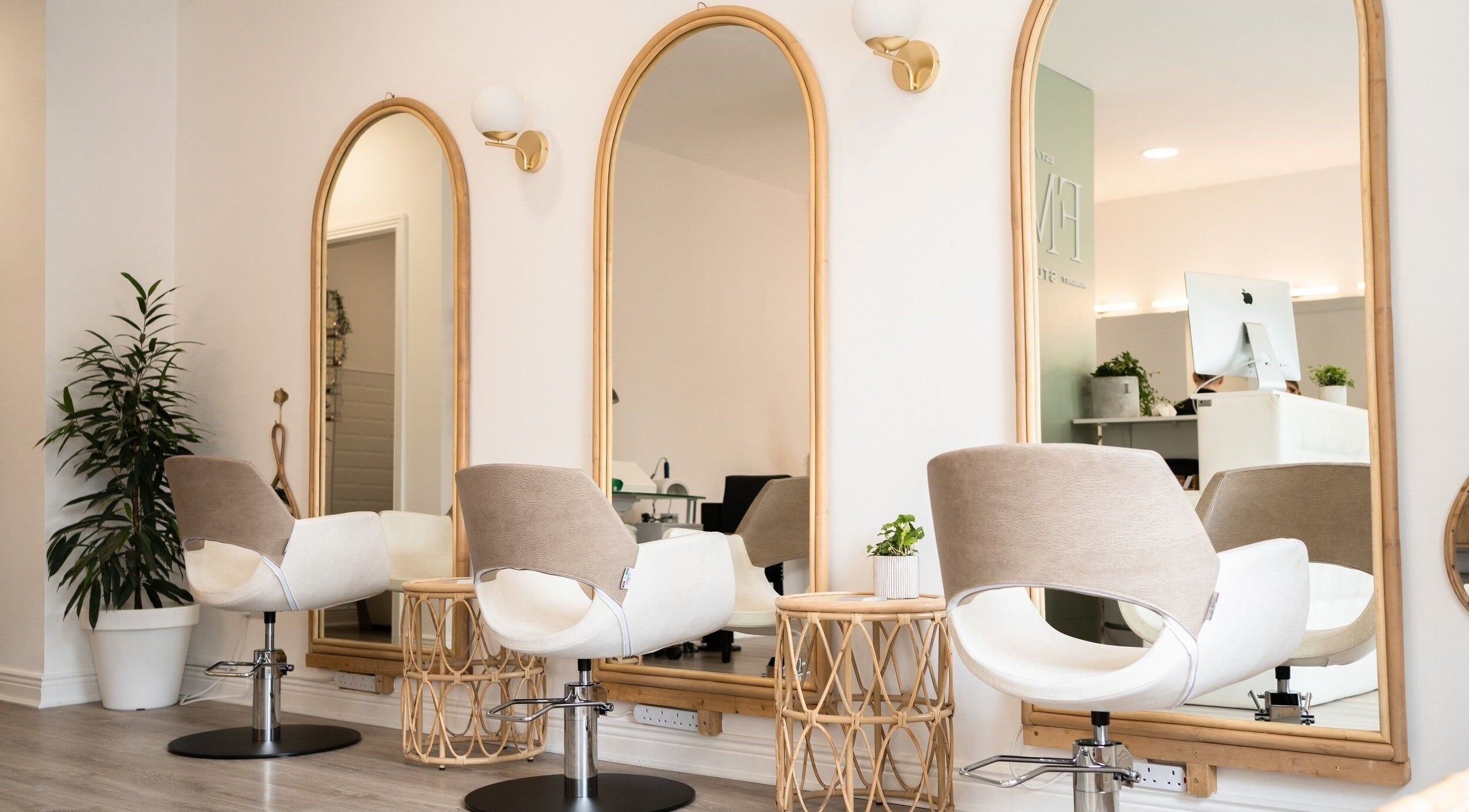 Chic salon interior at FMN Studio, Mungret Village, County Limerick, IE with modern chairs and elegant mirrors.