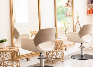 Chic salon interior at FMN Studio, Mungret Village, County Limerick, IE with stylish chairs and mirrors.