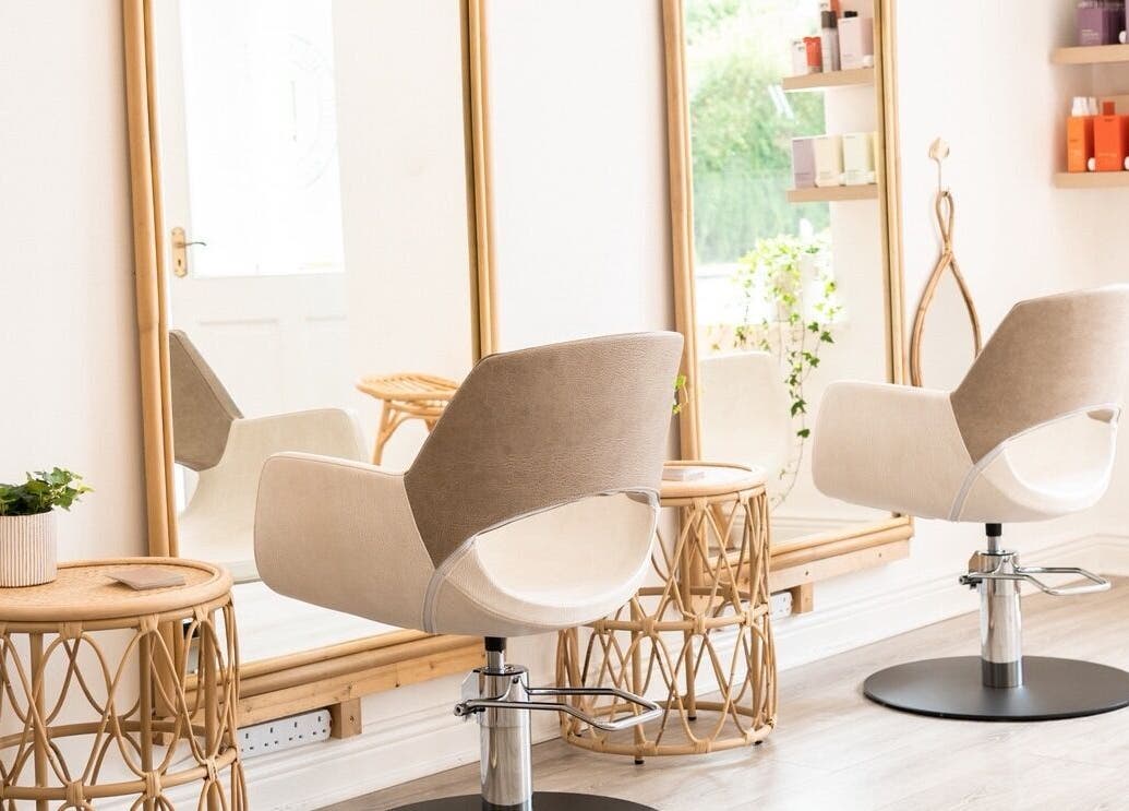 Chic salon interior at FMN Studio, Mungret Village, County Limerick, IE with stylish chairs and mirrors.
