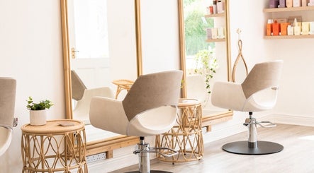 Chic salon interior at FMN Studio, Mungret Village, County Limerick, IE with stylish chairs and mirrors.