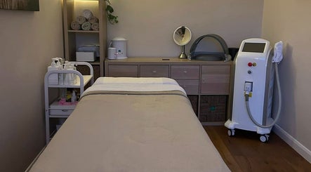 Serene treatment room at DL Beauty Clinic, Shipston-on-Stour, England, GB. Features massage bed and spa equipment.