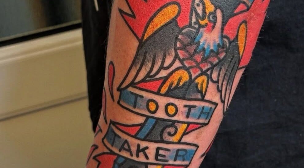 Colorful tattoo design at Loved by Few, Carlisle, England, GB featuring an eagle motif.