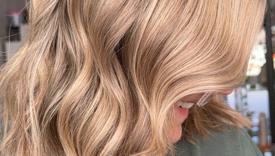 Close-up of soft golden hair waves at Roxanne Hair at Seafield Salon, Inverness, Scotland, GB.