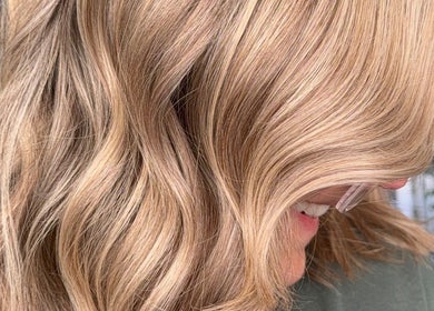 Close-up of soft golden hair waves at Roxanne Hair at Seafield Salon, Inverness, Scotland, GB.