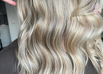Blonde wavy hair styled by Roxanne Hair at Seafield Salon, Inverness, Scotland, GB.