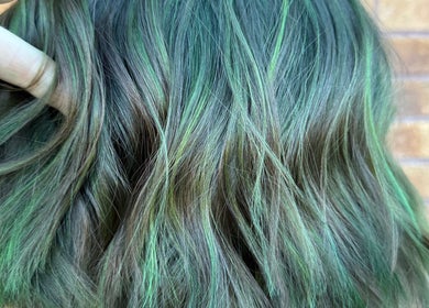 Vibrant green hair coloring at Roxanne Hair at Seafield Salon, Inverness, Scotland, GB.