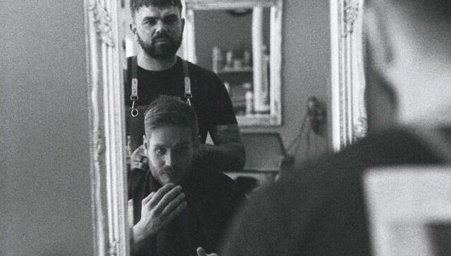 Travis Manning Hair Consultant working on a client in Great Yarmouth, England, GB.